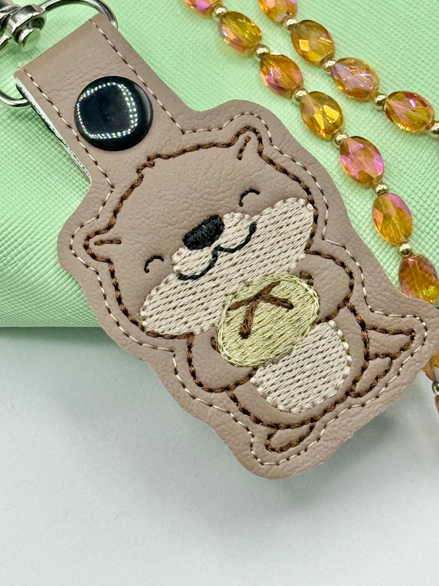 Cute Otter Holding Sourdough Keychain