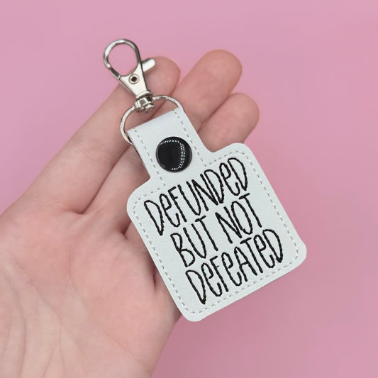 Defunded but Not Defeated Keychain