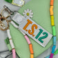 The Showgirl 12 keychain