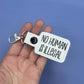 No Human Is Illegal keychain snap tab